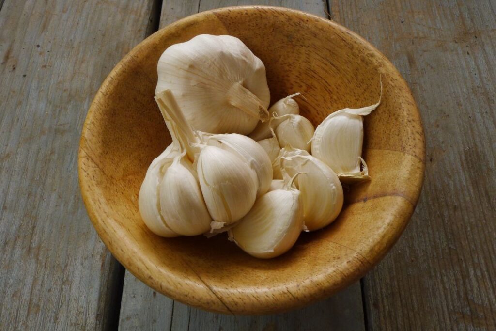 Cloves of Garlic in a Wooden Bowl